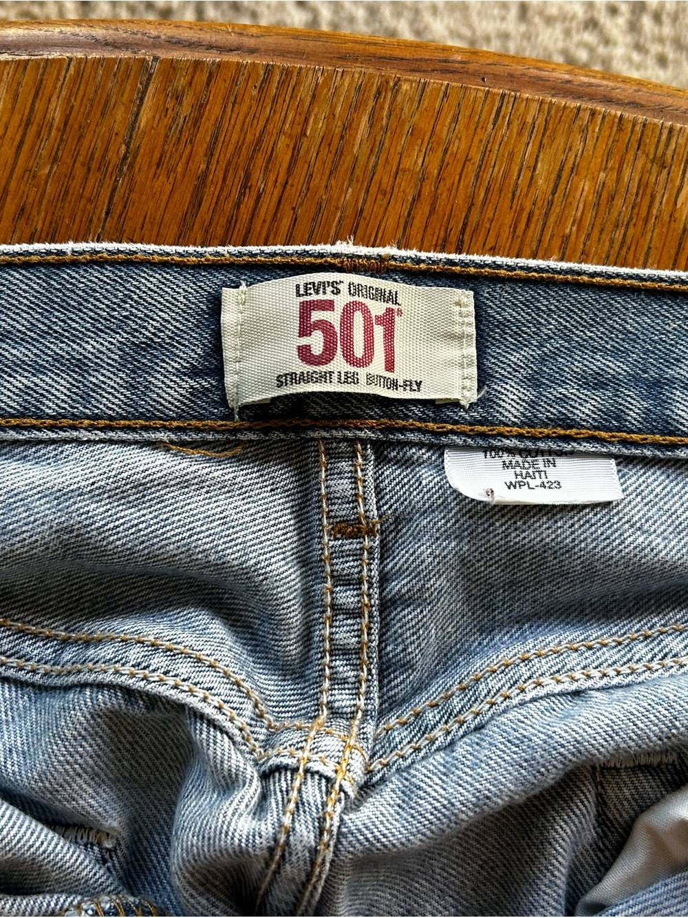 90’s vintage Levi's 501 Straight Men's Jeans in light blue with tan stitching.